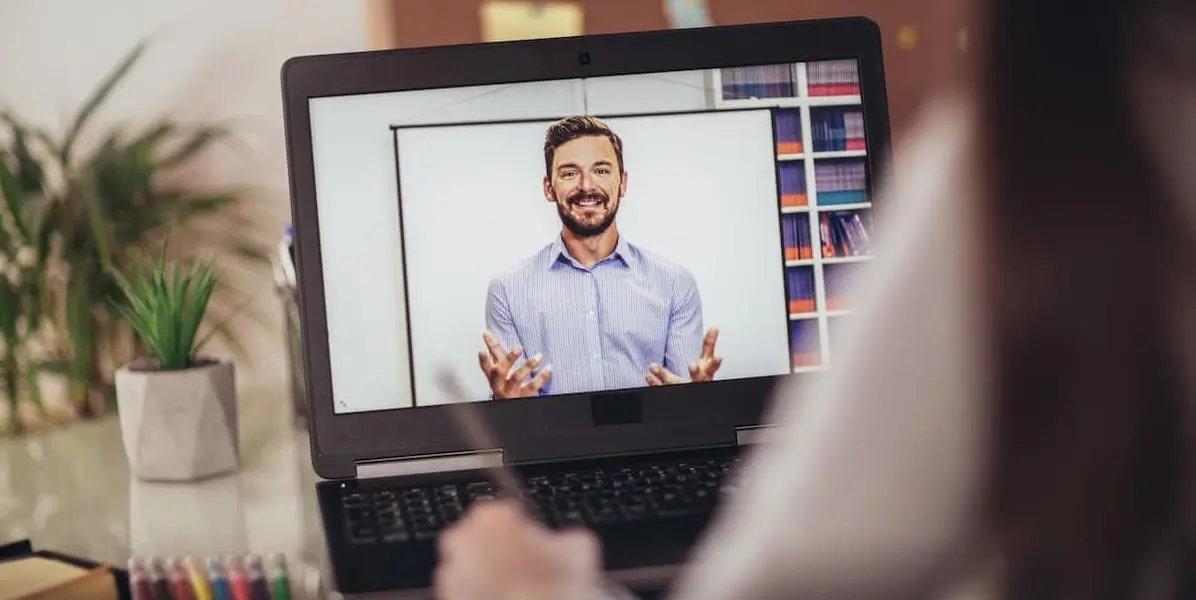 best online learning platforms A learner takes notes from a class on one of the best online learning platforms.